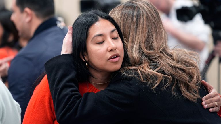 A mother of a victim is consoled. Pic: AP