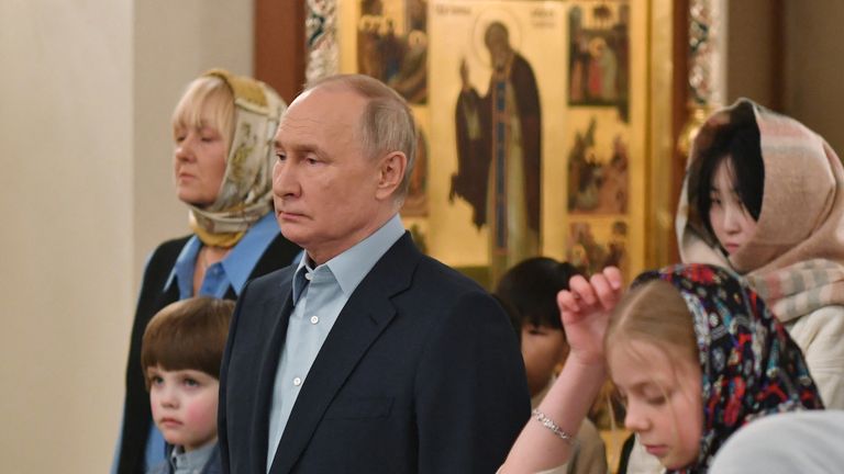 Vladimir Putin with the families of soldiers killed in Ukraine