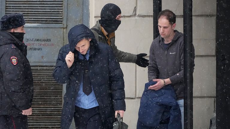 Wall Street Journal reporter Evan Gershkovich, right, is escorted from court in Moscow. Pic: AP