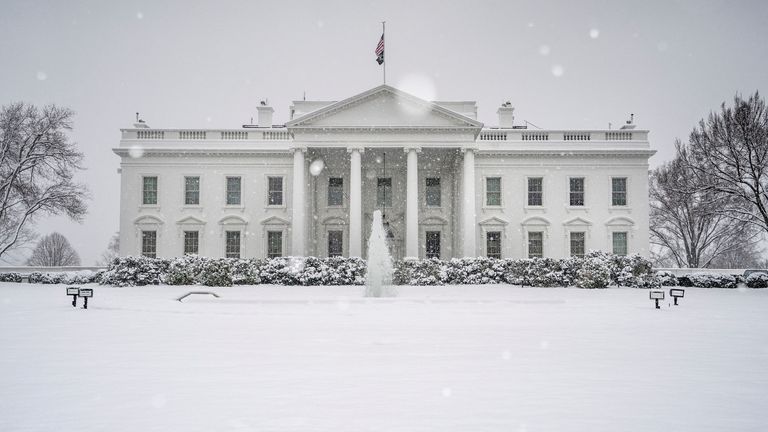 The White House is covered in snow in Washington, D.C., U.S. January 19, 2024. REUTERS/Ken Cedeno