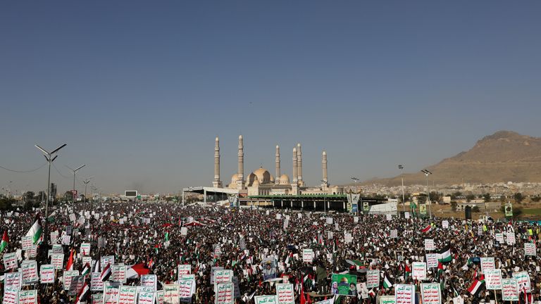 Supporters of the Houthi movement rally to denounce airstrikes launched by the US and Britain