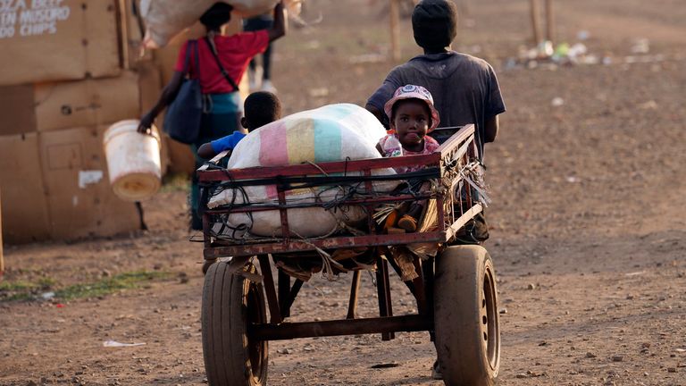 Children are transported using a push cart in Mbare, a poor neighbourhood in Harare, Zimbabwe, Tuesday Nov. 14, 2023. (AP Photo/Tsvangirayi Mukwazhi)