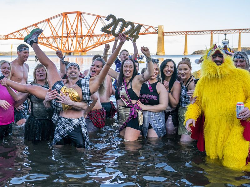 New Year: Hogmanay celebrations continue with ice-cold Loony Dook, UK News