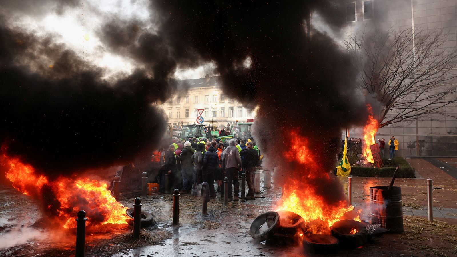 Fires erupt as farmers protest outside European Parliament in Brussels