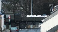 Bomb disposal experts remove a ordnance on the back of a vehicle near to the scene at St Michael Avenue
Pic: PA