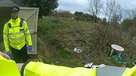 Police officers before the baby&#39;s body was found. Pic: Met Police