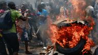 Protesters set fire to US flags and burned tyres in front of embassies in Kinshasa. Pic: Reuters