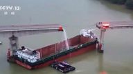 People inspect the broken Lixinsha Bridge after being hit by a container ship in Nansha District of Guangzhou.
Pic: CCTV/AP
