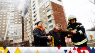 Firefighters work at a site of a building damaged during a Russian missile strike in Kyiv.
Pic: Reuters