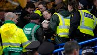 Medical staff and police gather around the fan who reportedly fell from the upper stands during the FA Cup fifth round match between Chelsea and Leeds United at Stamford Bridge. Pic: AP