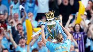 Manchester City&#39;s Erling  Haaland celebrates with the trophy after winning the Premier League.
Pic: Reuters