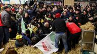 Farmers clash with members of the French police as they protest inside the Porte de Versailles exhibition centre on the day of French President Emmanuel Macron&#39;s visit to the International Agriculture Fair (Salon International de l&#39;Agriculture) during its inauguration in Paris, France, February 24, 2024. REUTERS/Stephanie Lecocq