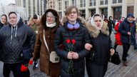 People, including activists of women&#39;s movement "Way Home" and relatives of servicemen of the Russian armed forces involved in a military campaign in Ukraine, gather to lay flowers at the Tomb of the Unknown Soldier by the Kremlin wall to demand the soldiers&#39; return from Ukraine front, in Moscow, Russia, February 3, 2024. REUTERS/Stringer