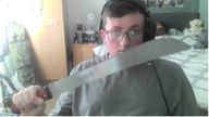 Jacob Graham, 20, holding a machete. The Liverpool man planned to carry out a bombing campaign.