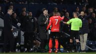 Birmingham City&#39;s Juninho Bacuna talks with the referee David Webb and fourth official after he was racially abused by a West Brom fan. Pic: Reuters