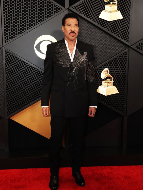 Lionel Richie in a striking dragonfly embroidered suit. Pic: AP