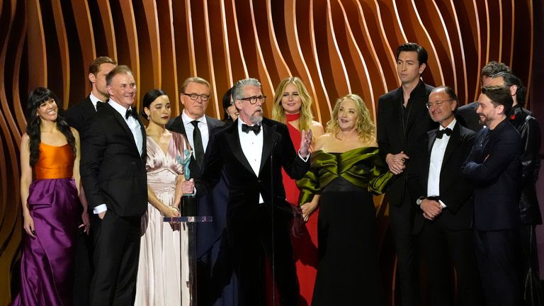 Alan Ruck, center, and the ensemble of "Succession" accept the award for outstanding performance by an ensemble in a drama series during the 30th annual Screen Actors Guild Awards on Saturday, Feb. 24, 2024, at the Shrine Auditorium in Los Angeles. (AP Photo/Chris Pizzello)
