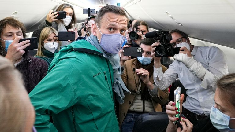 Alexei Navalny is surrounded by journalists on a plane before a flight to Moscow in the Berlin Brandenburg Airport  in 2017.
Pic: AP