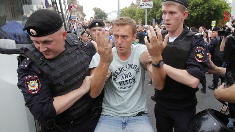 Policemen detain Russian opposition leader Alexei Navalny during a rally in 2019
Pic: Reuters