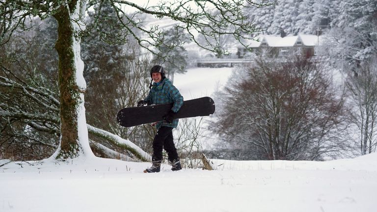 A snow boarder in Allenheads, Northumberland.
Pic:PA