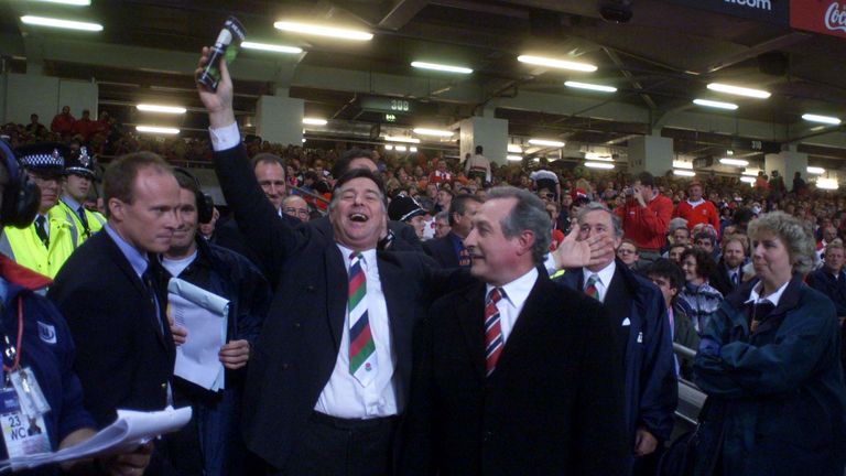 File photo dated 01-10-1999 of Former Wales players Barry John (centre) and Gareth Edwards (right) enjoy the opening ceremony of the 1999 Rugby World Cup. Former Wales and British and Irish Lions fly-half Barry John has died aged 79, his family have said in a statement. Issue date: Sunday February 4, 2024.