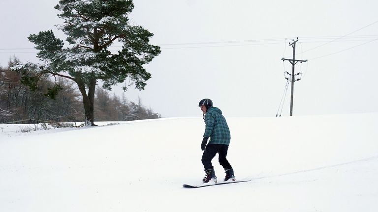 A snow boarder in Allenheads, Northumberland.
Pic:PA
