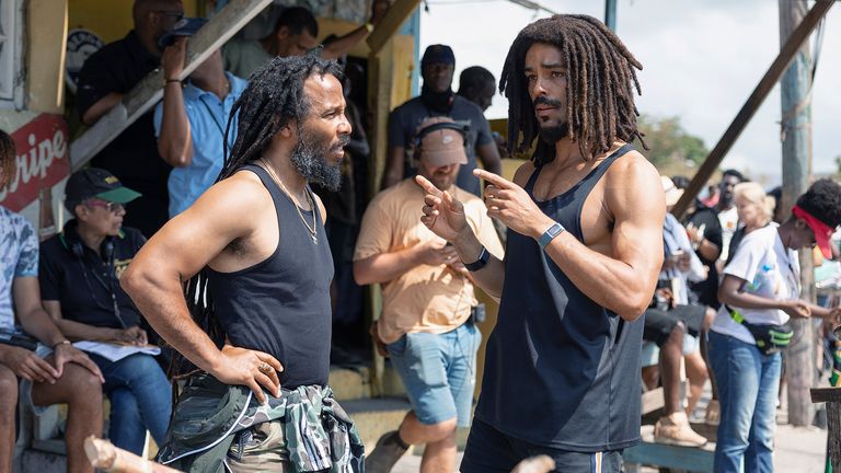 This image released by Paramount Pictures shows producer Ziggy Marley, left, and Kingsley Ben-Adir  on the set of "Bob Marley: One Love." (Chiabella James/Paramount Pictures via AP)