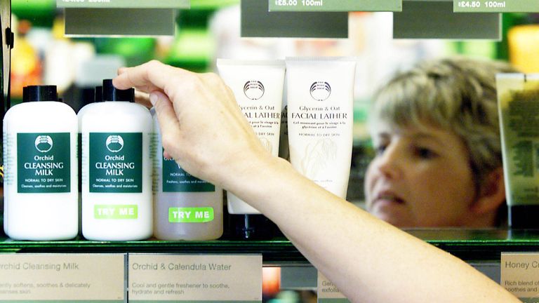 A customer reaches for a Body Shop product inside their store in Rugby town.
Pic: Reuters