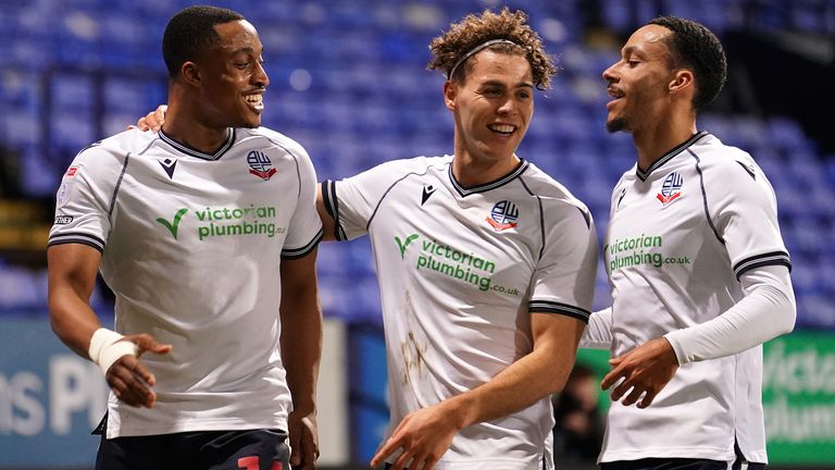 Bolton Wanderers' Victor Adeboyejo (left) celebrates scoring with team-mates Dion Charles and Josh Dacres-Cogley. Pic: Martin Rickett/PA Wire