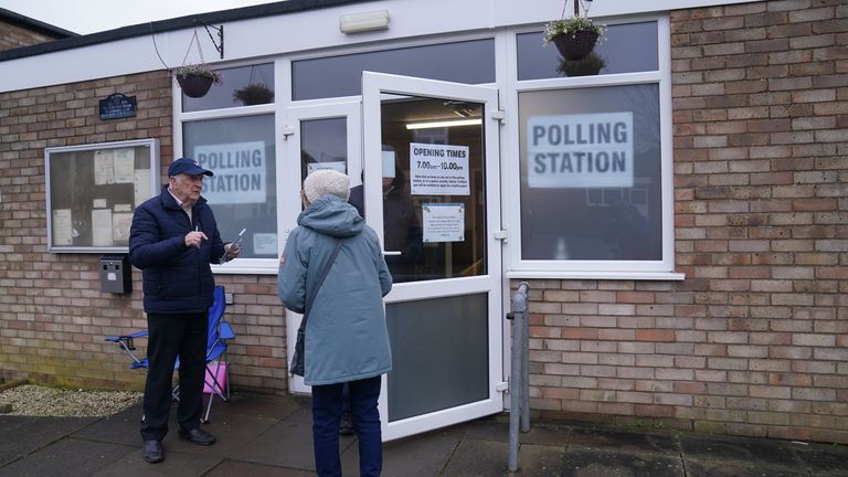 People arrive at Irchester Village Hall, as voting gets underway in Wellingborough.
Pic: PA