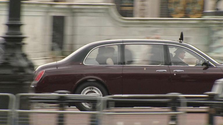 A car believed to be carrying King Charles and Queen Camilla returns to Buckingham Palace