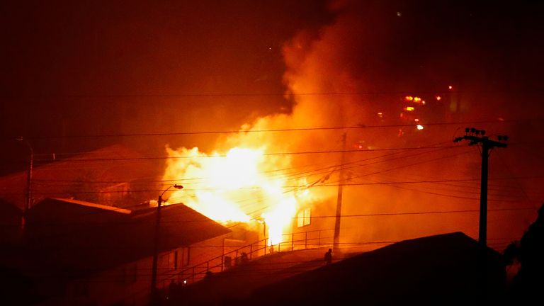 A house burns following the spread of wildfires in Vina del Mar, Chile February 3, 2024. REUTERS/Rodrigo Garrido