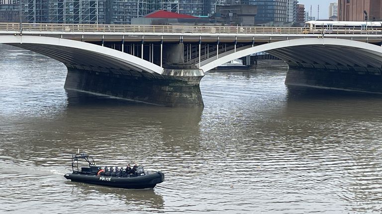 Police search the Thames at Chelsea Bridge 