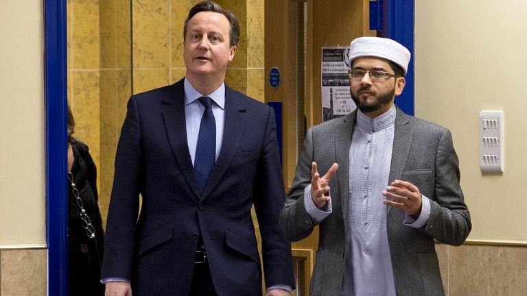 Prime Minister David Cameron talks to Imam Qari Asim. Pic: PA 