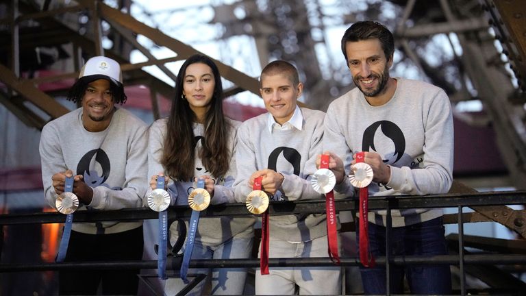 Paris 2024 Olympics Organizing Committee President Tony Estanguet, right, French athletes Marie Patouillet, center right, Sara Balzer, center left, and Arnaud Assoumani, left, present the Paris 2024 Olympic and Paralympic medals at the Eiffel Tower.
Pic: AP