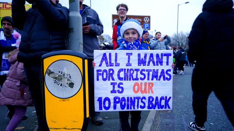 File pic: PA
File photo dated 26-11-2023 of An Everton fan holds up a sign in protest of the club&#39;s point deduction. Everton???s 10-point deduction for breaching profitability and sustainability rules has been reduced to six following an appeal, the Premier League has announced. Issue date: Monday February 26, 2024.