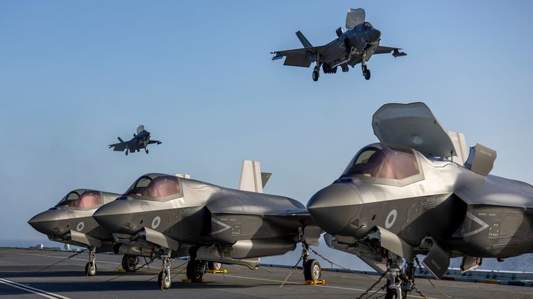 Pic: AS1 Amber Mayall RAF/PA Wire
Ministry of Defence undated handout photo of F-35B Lightning jets on the flight deck of the Royal Navy aircraft carrier HMS Prince of Wales as it heads to join the largest Nato exercise since the Cold War