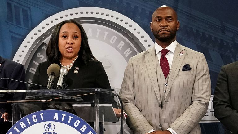 Fulton County District Attorney Fani Willis speaks at a press conference next to prosecutor Nathan Wade in November 2023