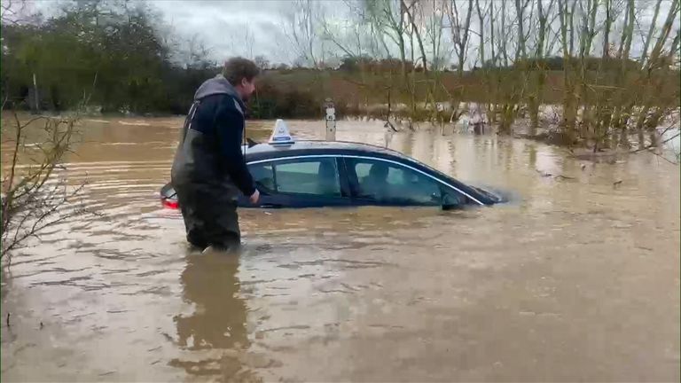Filmmaker Jamie Price and his partner Danielle braved the four-foot-deep floods to rescue a driving instructor trapped in his car in Essex.