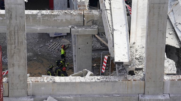 Firefighters arrive at the scene of an accident at a construction site in Florence, Italy, Friday Feb. 16, 2024. An accident at a supermarket construction site in the Italian city of Florence on Friday killed at least one worker and left four others missing, officials said. (Marco Bucco/LaPresse via AP)