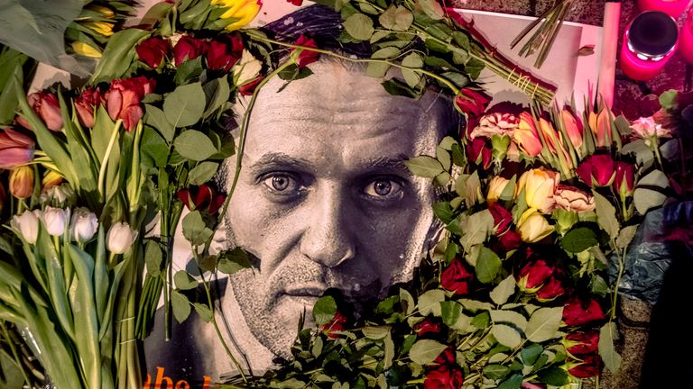Flowers and a photo of Russian opposition leader Alexei Navalny are placed near the Russian consulate in Frankfurt
Pic:AP