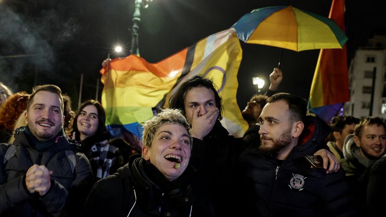 Members of the LGBTQ+ community and supporters celebrate in front of the Greek parliament, after the vote in favour of a bill which approved allowing same-sex civil marriages, in Athens, Greece, February 15, 2024. REUTERS/Louisa Gouliamaki
