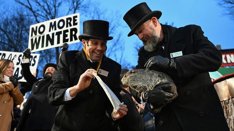 Pic: AP Photo/Barry Reeger
Groundhog Club handler A.J. Dereume holds Punxsutawney Phil, the weather prognosticating groundhog, as vice president Dan McGinley reads the scroll during the 138th celebration of Groundhog Day on Gobbler&#39;s Knob in Punxsutawney, Pa., Friday, Feb. 2, 2024. Phil&#39;s handlers said that the groundhog has forecast an early spring.