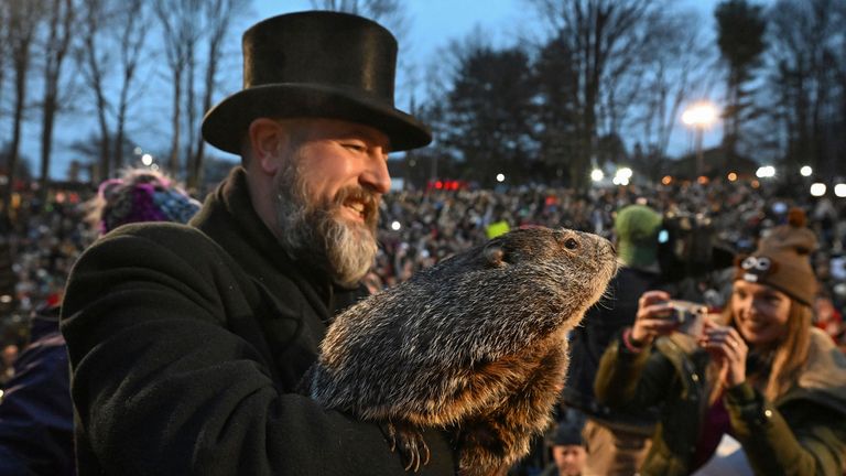 Pic: AP
Groundhog Club handler A.J. Dereume holds Punxsutawney Phil, the weather prognosticating groundhog, during the 138th celebration of Groundhog Day on Gobbler&#39;s Knob in Punxsutawney, Pa., Friday, Feb. 2, 2024. Phil&#39;s handlers said that the groundhog has forecast an early spring. (AP Photo/Barry Reeger)
