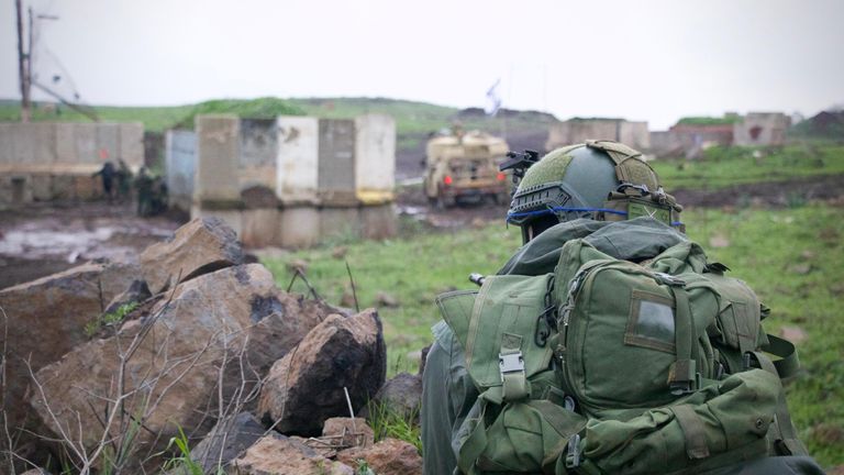 Still of an IDF soldier carrying out drills in the Golan Heights. Alistair Bunkall piece.
