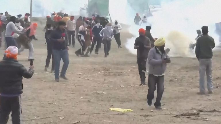 India: Authorities use tear gas and block entry points to New Delhi in a bid to stop farmer protests | World News | Sky News