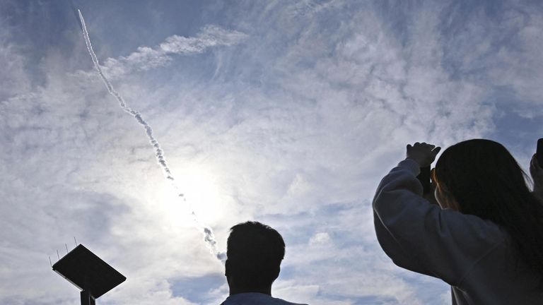 A second test model of H3 rocket rises into the air after blasting off from the launching pad at Tanegashima Space Center while people look on, on the southwestern island of Tanegashima, Kagoshima Prefecture, Japan February 17, 2024, in this photo taken by Kyodo. Mandatory credit Kyodo via REUTERS ATTENTION EDITORS - THIS IMAGE WAS PROVIDED BY A THIRD PARTY. MANDATORY CREDIT. JAPAN OUT. NO COMMERCIAL OR EDITORIAL SALES IN JAPAN
