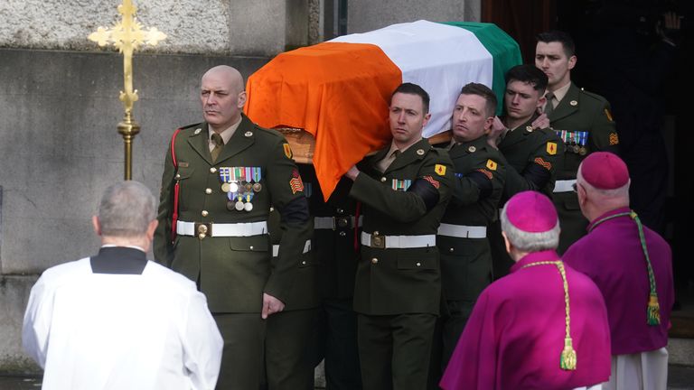 John Bruton's coffin was draped in the Irish flag for its final journey. Pic: Brian Lawless/PA Wire
