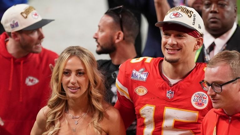 Kansas City Chiefs quarterback Patrick Mahomes walks off the field with his wife Brittany Mahomes after the NFL Super Bowl 58 football game against the San Francisco 49ers on Sunday, Feb. 11, 2024, in Las Vegas. The Chiefs won 25-22 against the 49ers. (AP Photo/Abbie Parr)