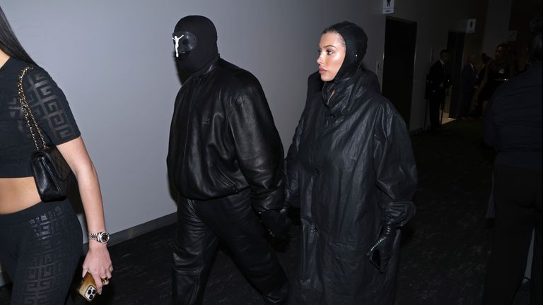 Kanye West, left and, Bianca Censori arrive during the NFL Super Bowl 58 football game Sunday, Feb. 11, 2024, in Las Vegas. (AP Photo/Mark Von Holden)
